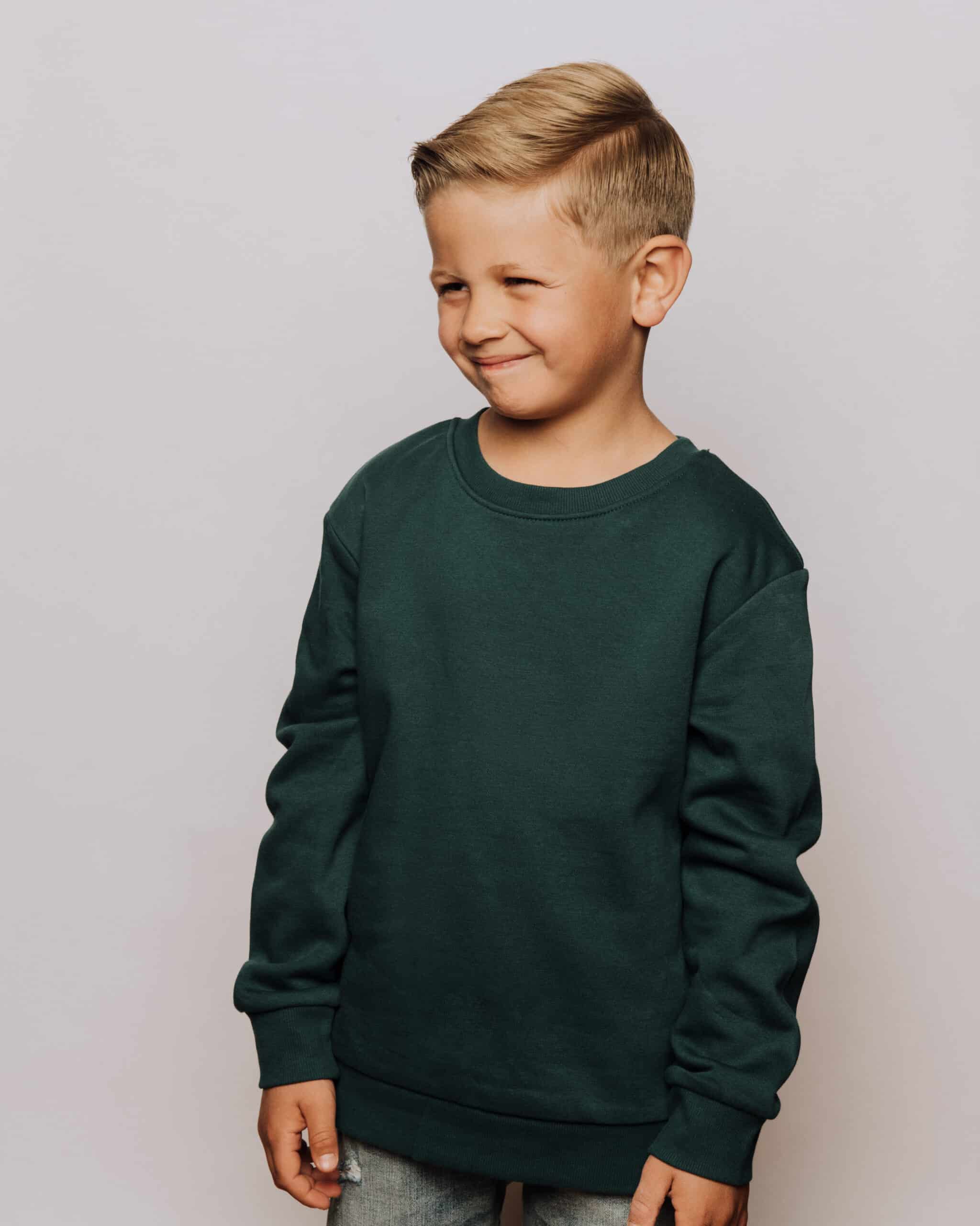 Young boy with a short haircut.